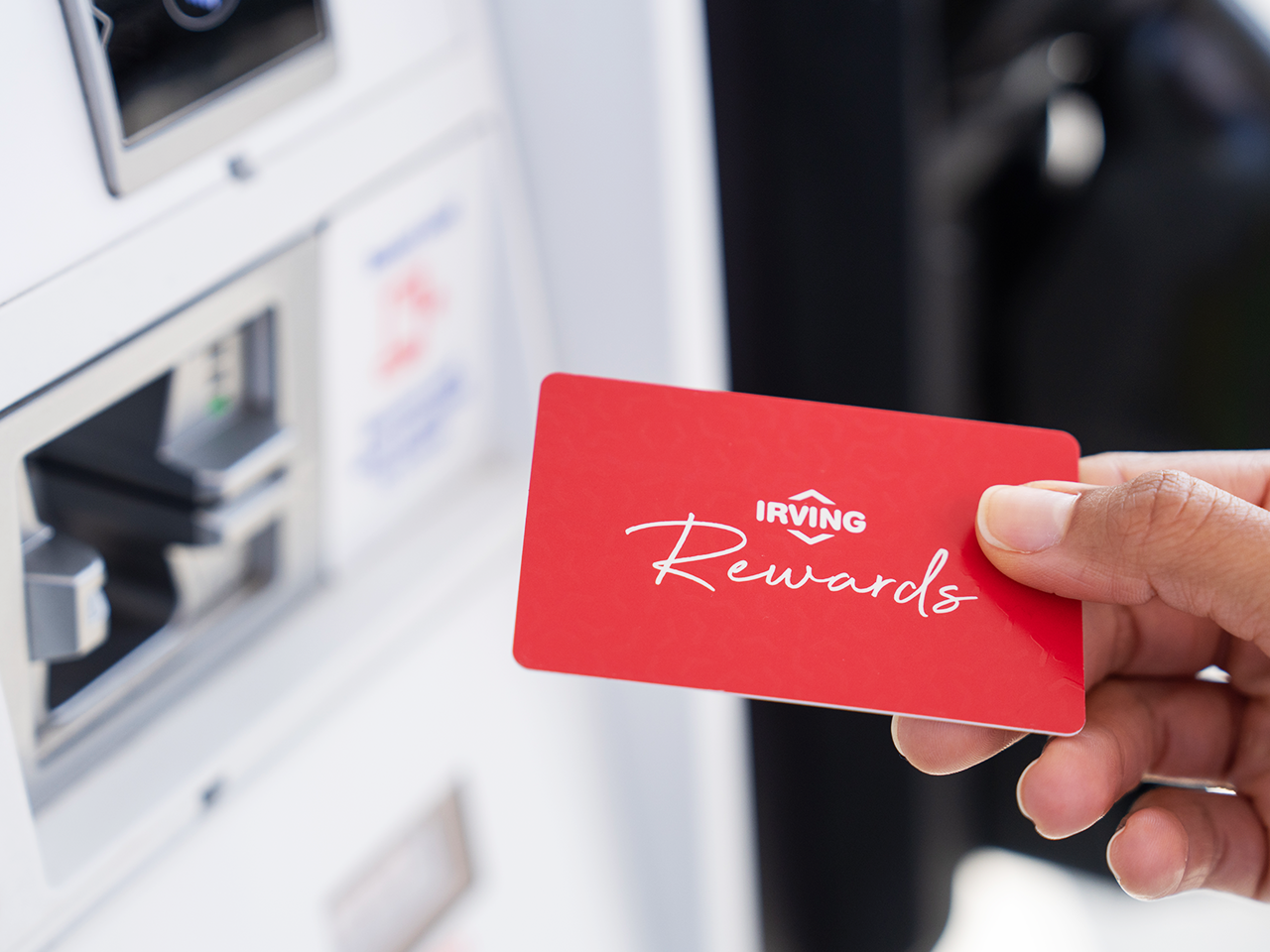 Customer saving on gas with their Irving Rewards card